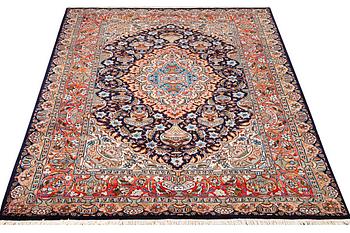 A Kashmar carpet, c. 310 x 203 cm.