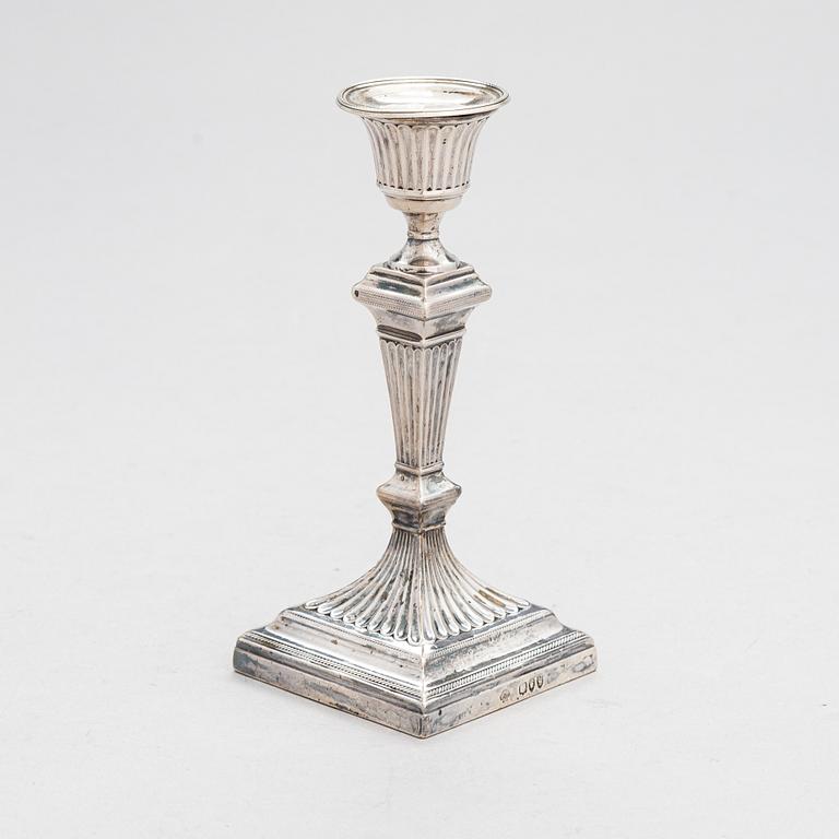 A late 19th-century sterling silver candlestick, maker's mark of William Hutton & Sons, London 1893.
