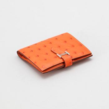 1310. A wallet by Hermès.