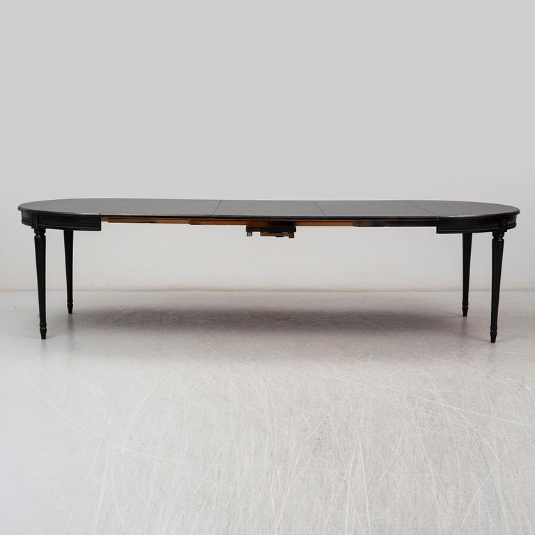 A late 20th Century painted table.