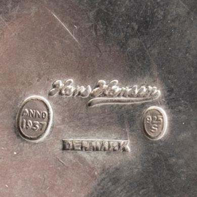 A 20th century Danish salter mark of H Hansen 1937 and two unmarked candlesticks total weight 151 gr.