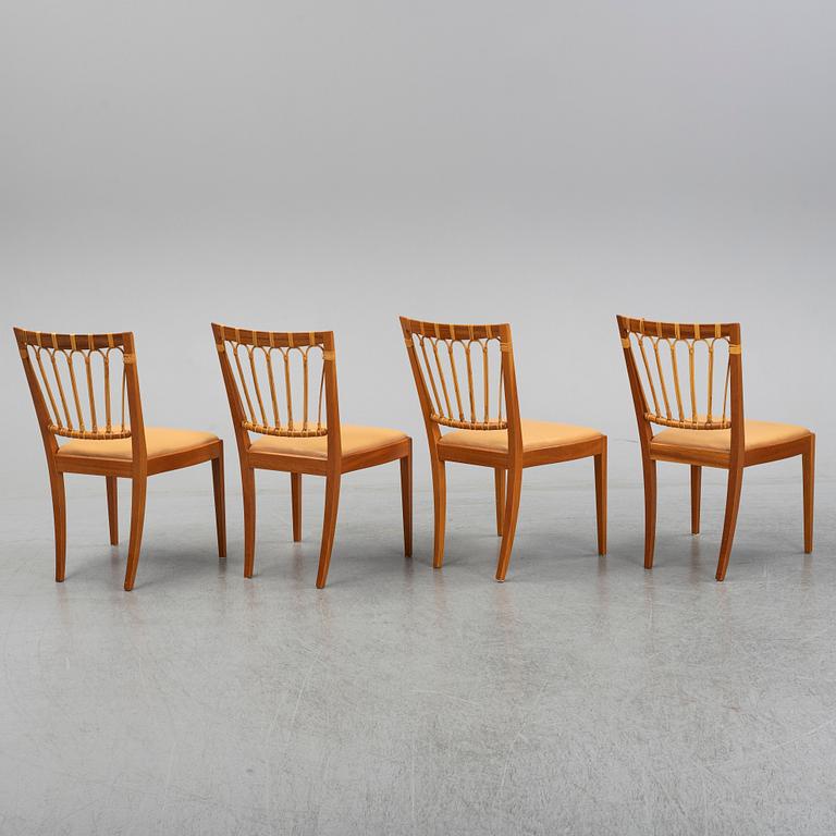 A set of four of Josef Frank mahogany and rattan dining chairs, Svenskt Tenn, Stockholm, Sweden.