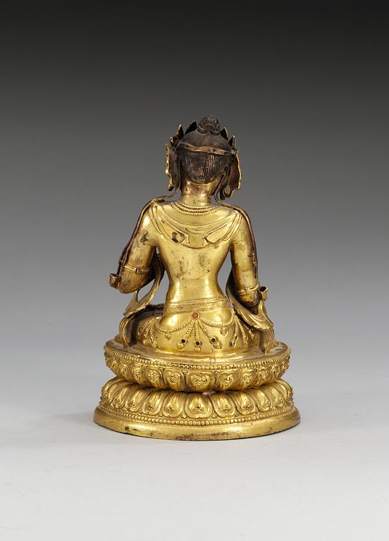 A gilt copper figure of Buddha, late Qing dynasty, 19th Century.