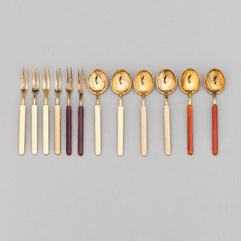 A 12-piece set of 1950s two-tine forks and espresso spoons in gilt silver and enamel, Tillander, Helsinki 1951-55.