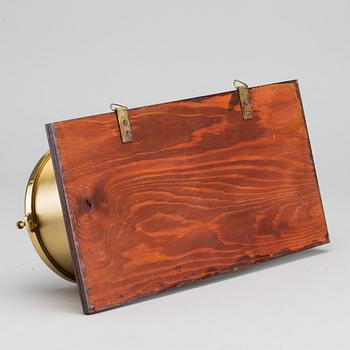 A BRASS MARINE CLOCK AND BAROMETER BY STOCKBURGER.