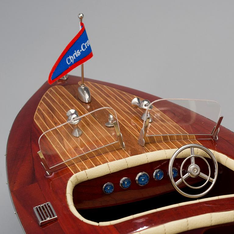 A "Chris-Craft triple cockpit" model boat, 21st century.