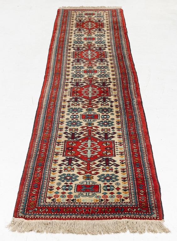 An oriental runner, c. 355 x 75 cm.