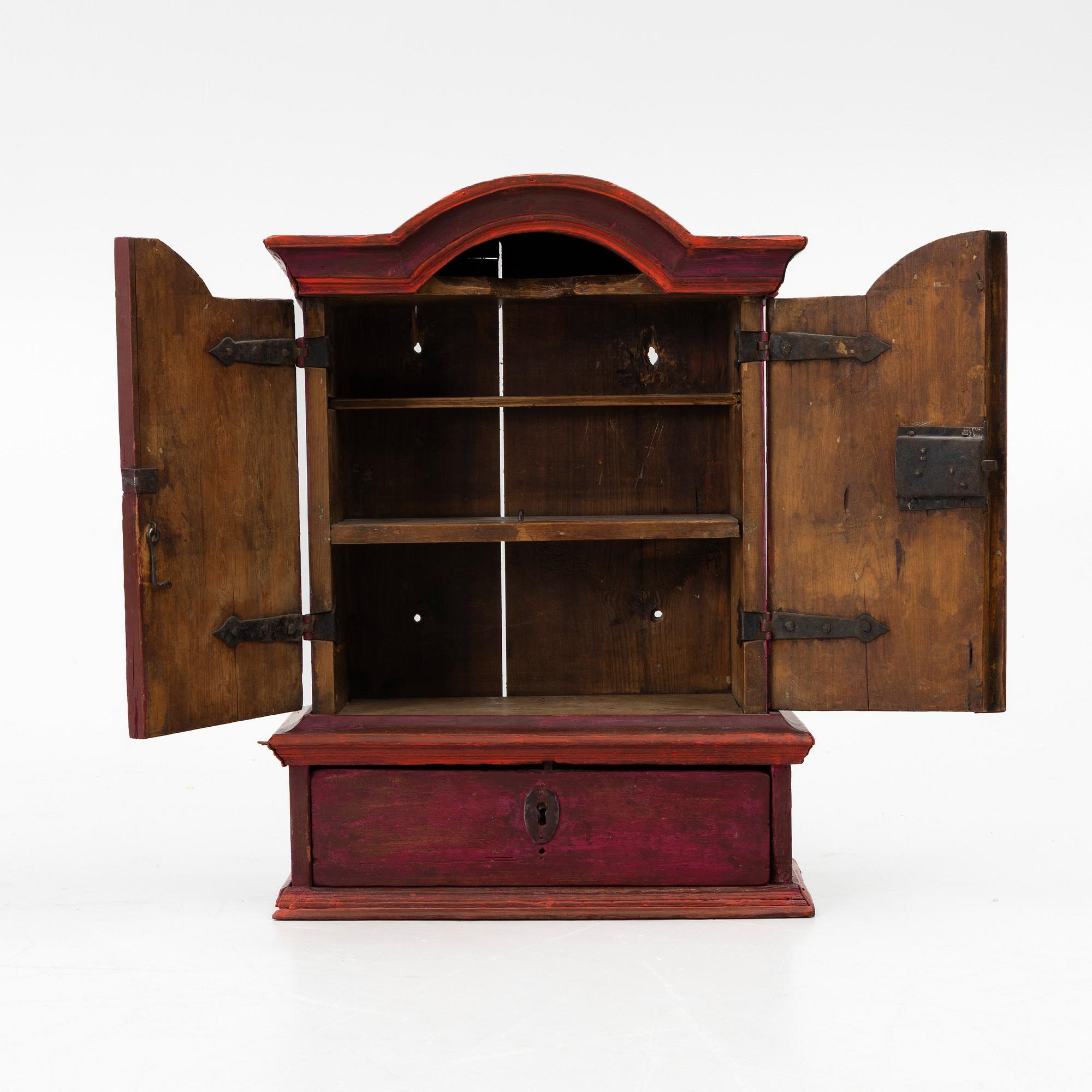 A 18th century Swedish wall-hanged cabinet.