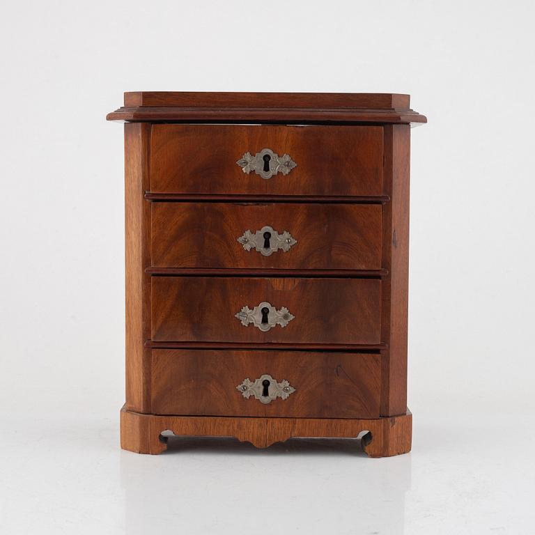 A mahogany miniature commode, later part of the 19th century.