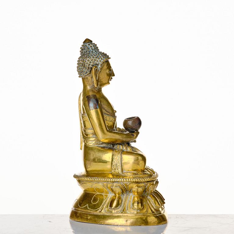 A seated bronze figure of amithaba buddha, Tibeto-chinese, 18th Century.