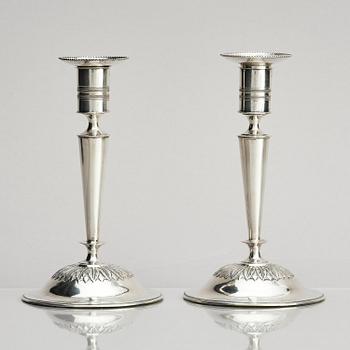 Two pair of early 19th century silver candlesticks, marks of Anders Lundqvist, Stockholm, Sweden 1819 and 1821.