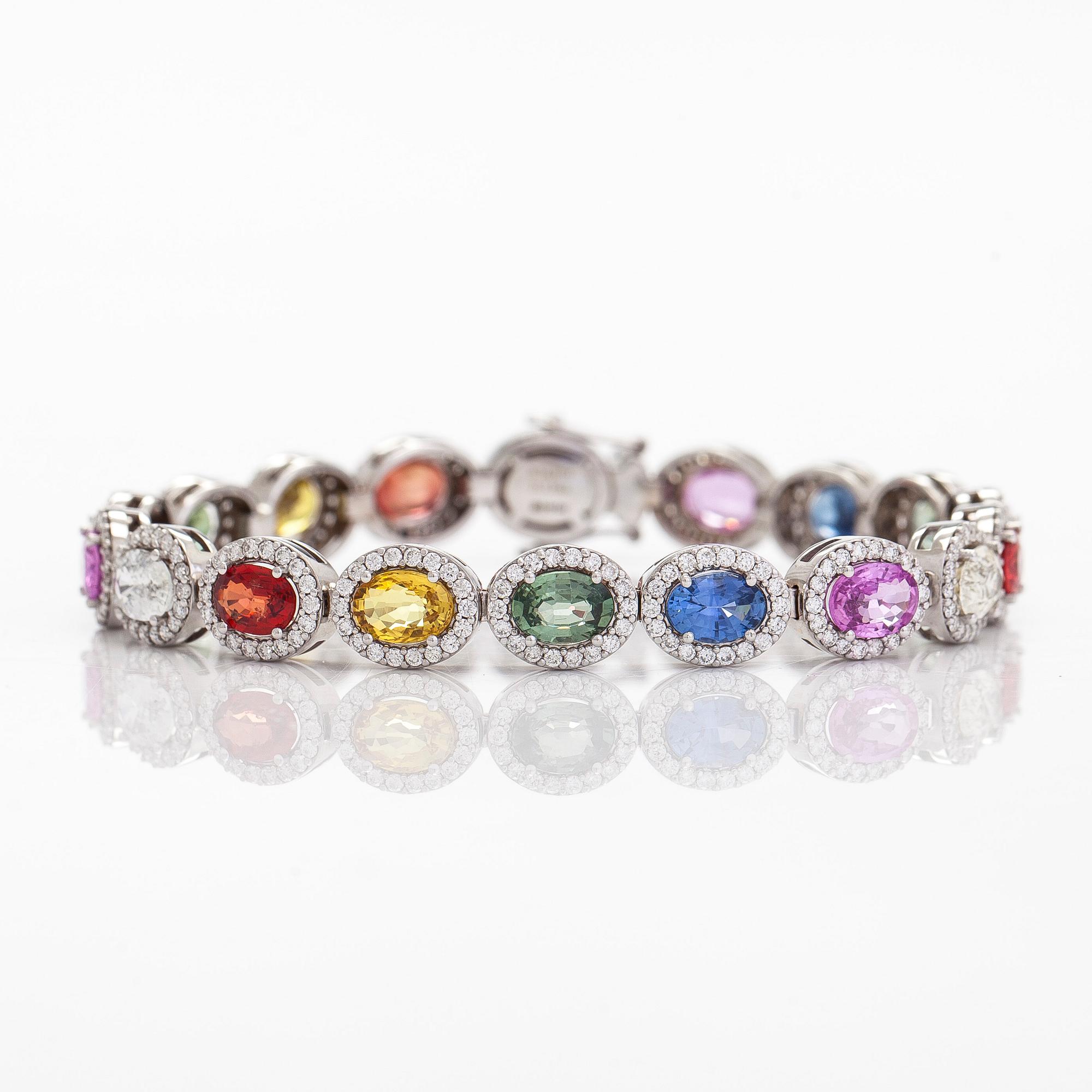 A multi-colour sapphire and diamond bracelet in 14K whitegold.