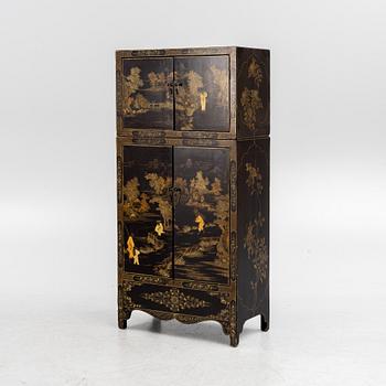 A Chinese lacquered two-part cabinet, first part of the 20th century.