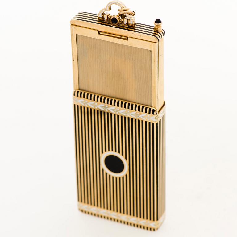 A Cartier Art Deco Vanity Case/Minaudière in 18K gold, black enamel and onyx.