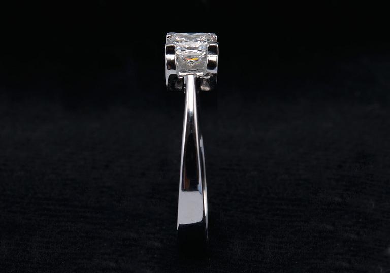 A RING, princess cut diamond 0.71 ct. H/vvs1 laserengraved ID no. GIA certifikat 18K white gold, weigth 5,1 g.