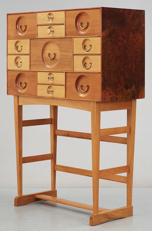 A Josef Frank cabinet on stand with thirteen different size  drawers,