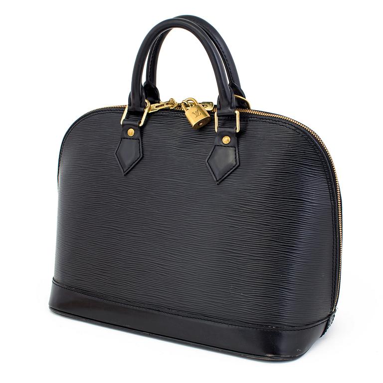 A black epi "Alma" handbag and keyholder by Louis Vuitton.