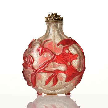 A red overlay Beijing glass snuff bottle, Qing dynasty.