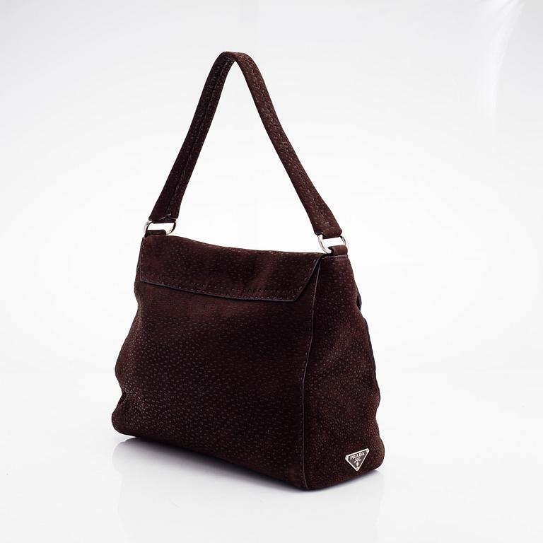 Prada, A leather handbag.