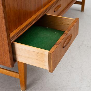 A mid20th century teak-veneered sideboard.