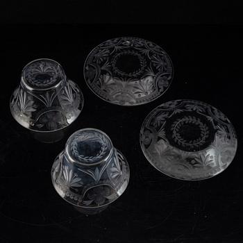 A pair of glass bowls with dishes, 20th century.