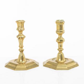 A set of two Northern European late baroque brass candlesticks, first part 18th century.