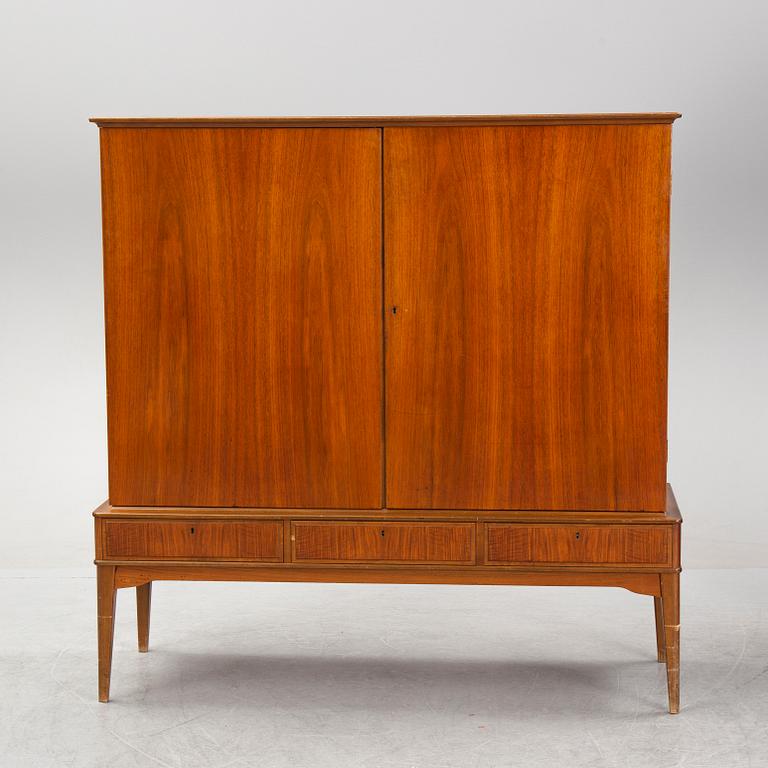 A walnut veneered cabinet, 1940's/50's.