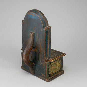 A painted wood alms box, probably 17th century.