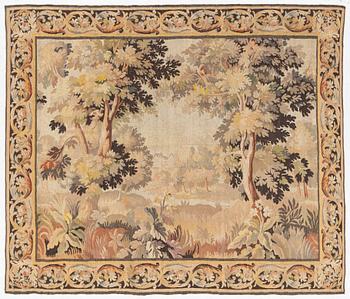 A European 'verdur' tapestry, c. 297 x 290 cm, 17th century.