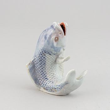 A Japanese porcelain model of a leaping fish, Meiji period (1868-1912).