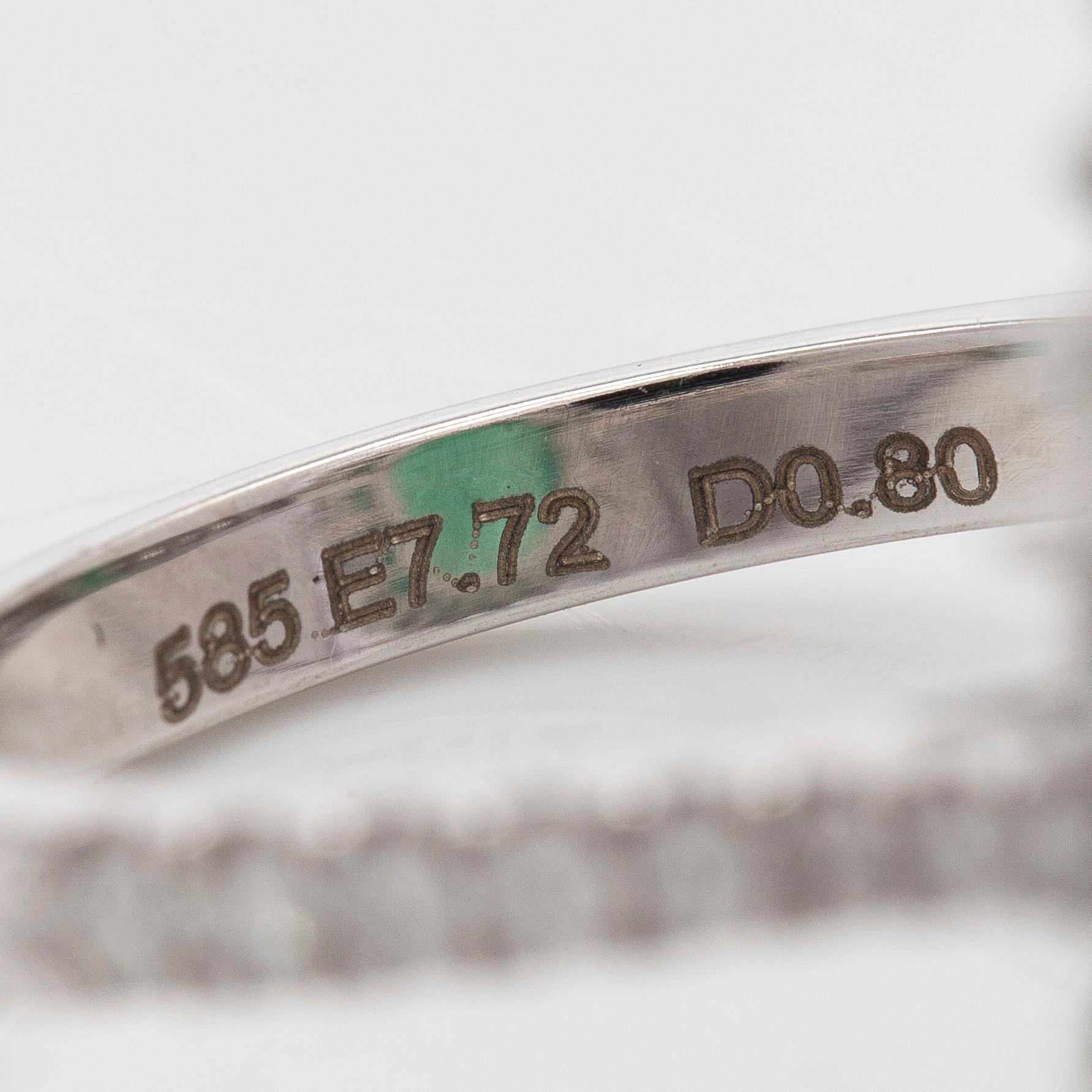 A 14K white gold ring, with a pear-cut  emerald ca. 7.72 ct and diamonds.