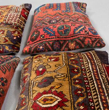 Six pillows made from rugs.