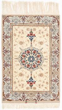 A part silk Isfahan rug, signed, c. 125 x 84 cm.