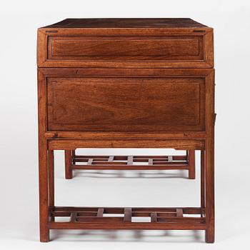 A six-drawer 'jichimu' pedestal partners desk, late Qing dynasty/early 20th century.