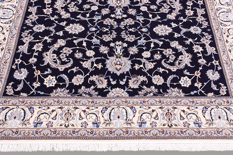 A carpet, Nain part silk s.k 6LAA, ca 300 x 212 cm.