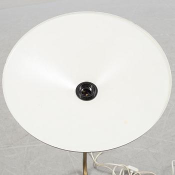 A 20th century brass and painted metal swing-arm wall light.