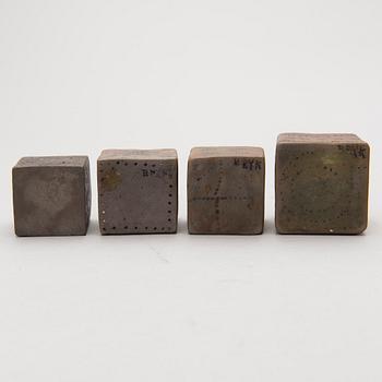 Four stoneware cruets, signed Bryk.