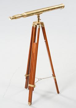 A spotting scope with a wooden stand, second half of the 20th century.