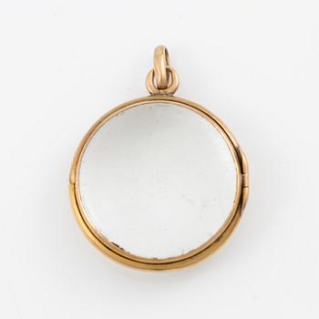 Medallion, gold and glass.