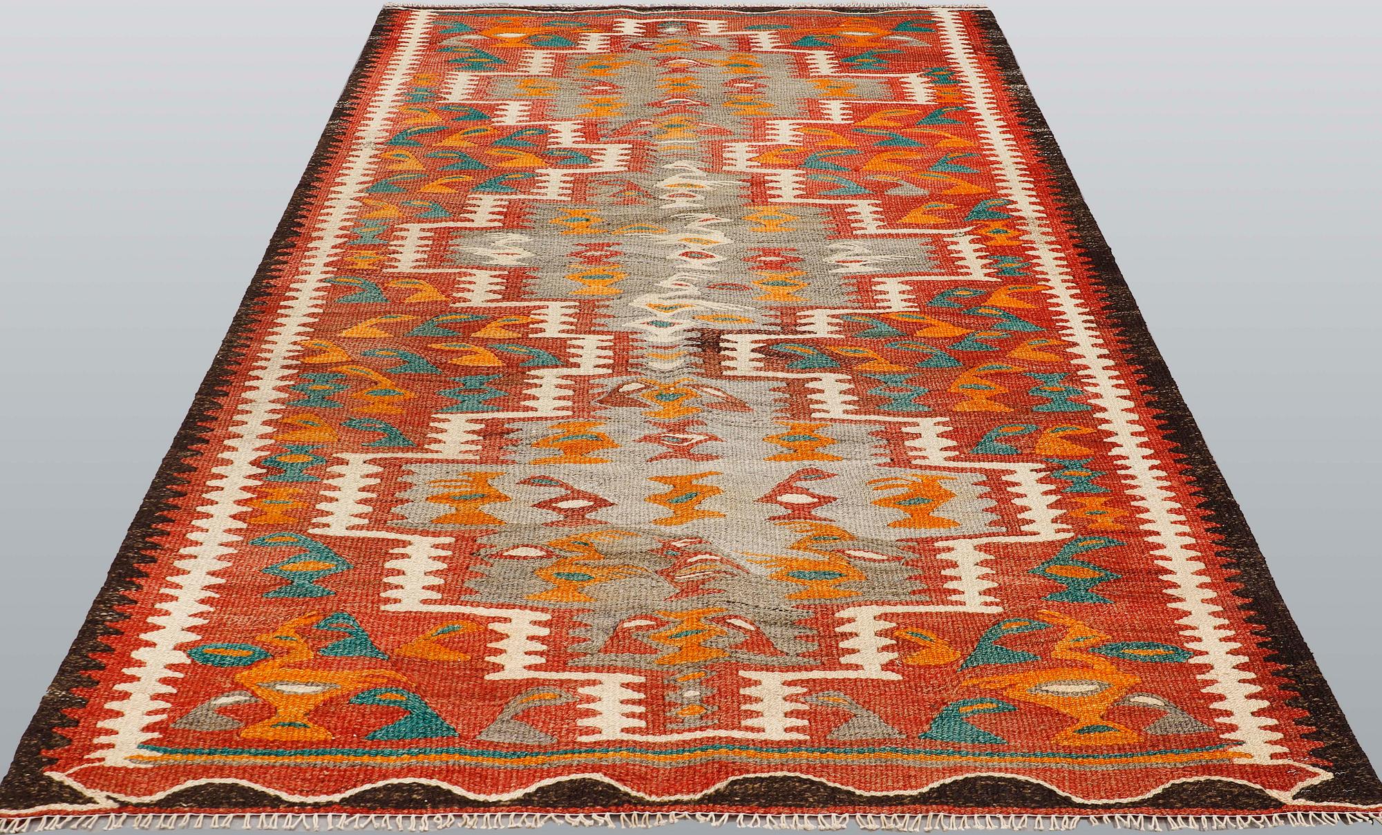 A Nomad Kilim rug, approx. 255 x 150 cm.