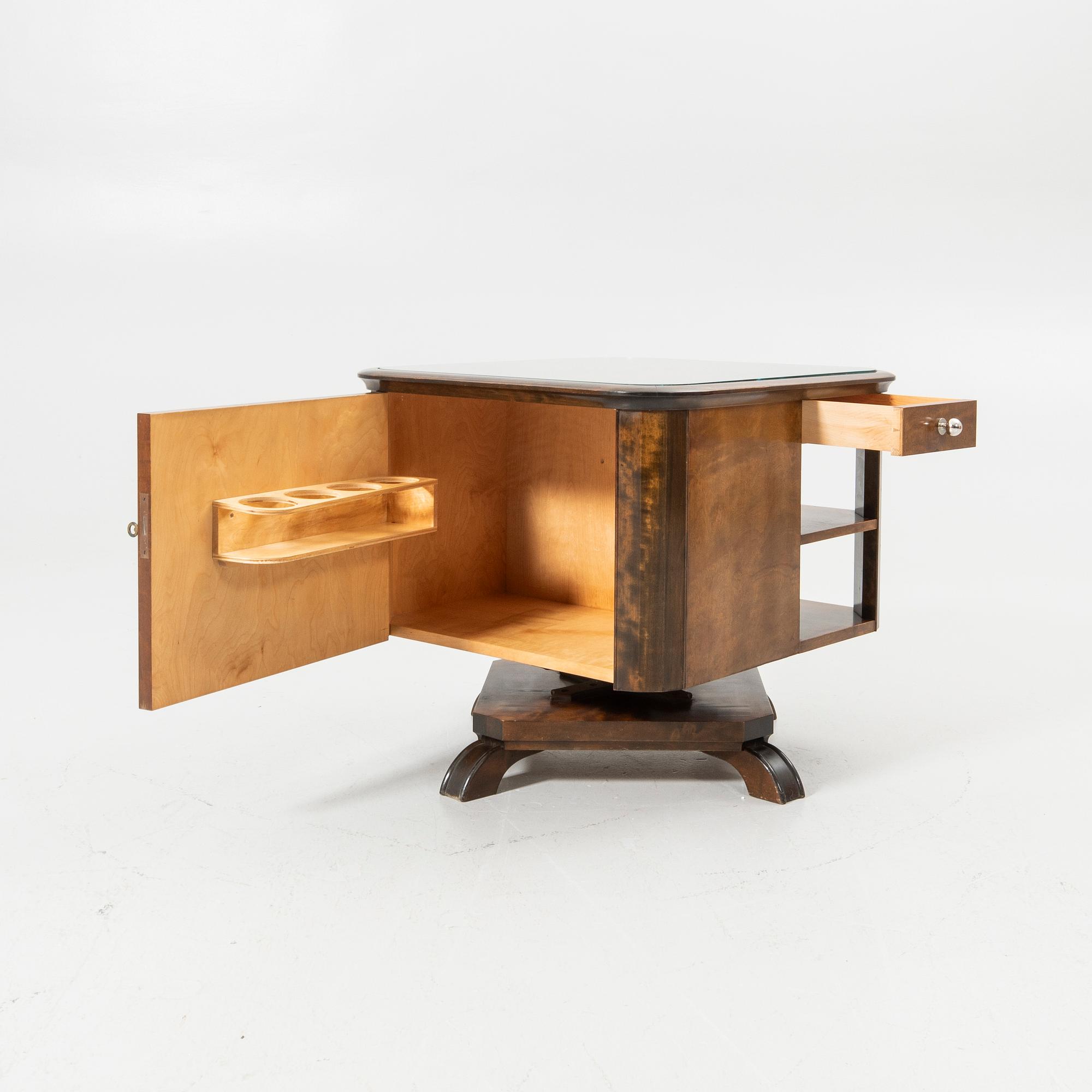 Rotating table with fitted bar, 1930s/40s.