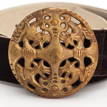 A leather belt with a bronze buckle, model 27. Kalevala Koru, Helsinki.