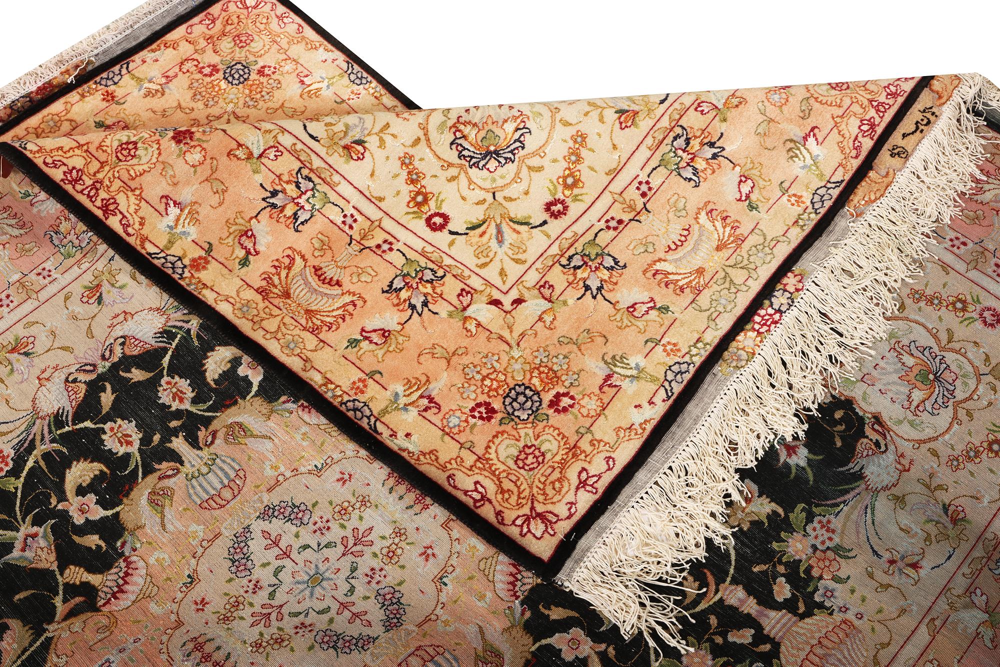 A Tabriz rug, part silk, 50 raj, a. 210 x 147 cm.