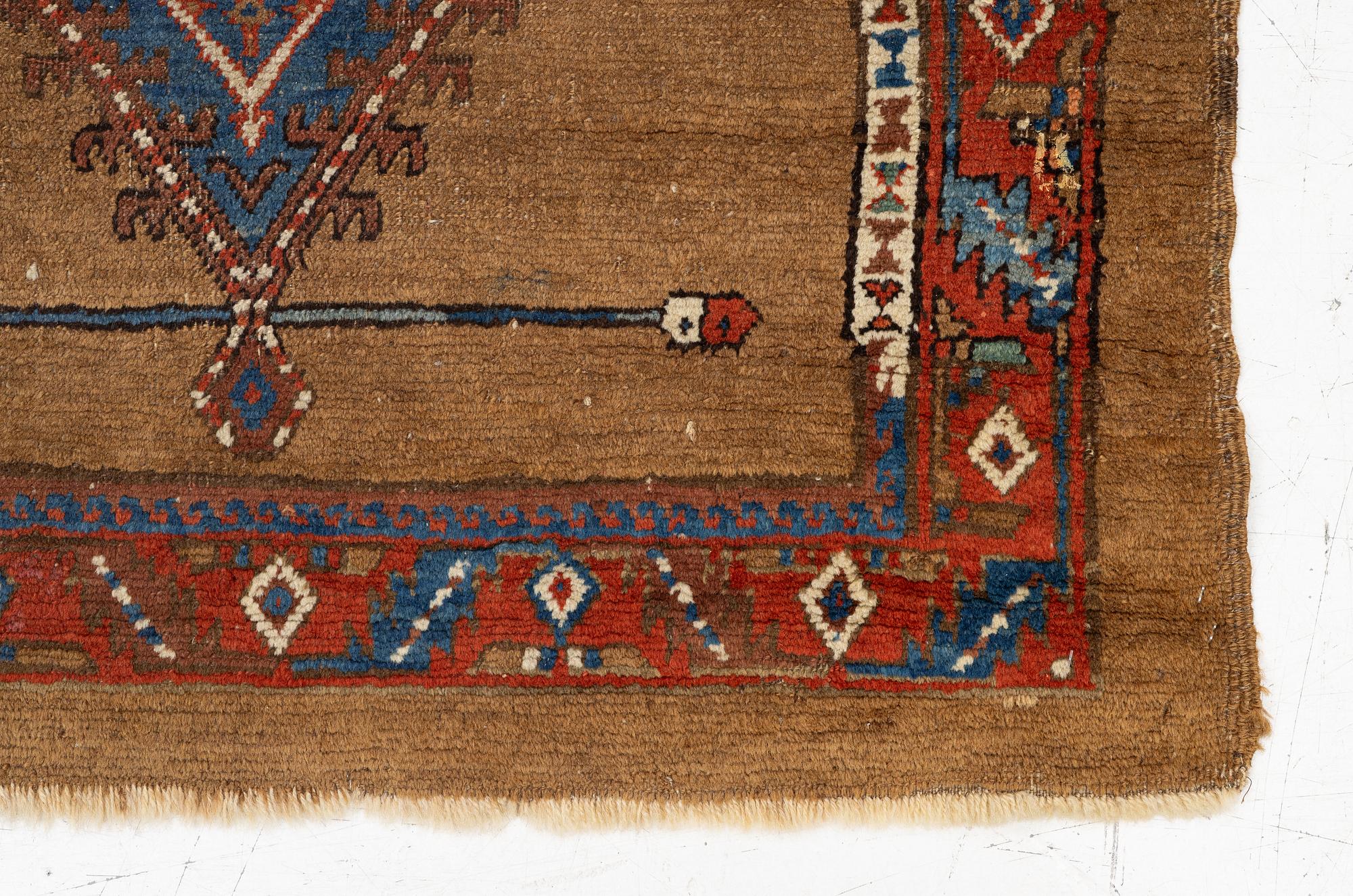 An antique Sarab rug, northwestern Iran, c. 213 x 107 cm.