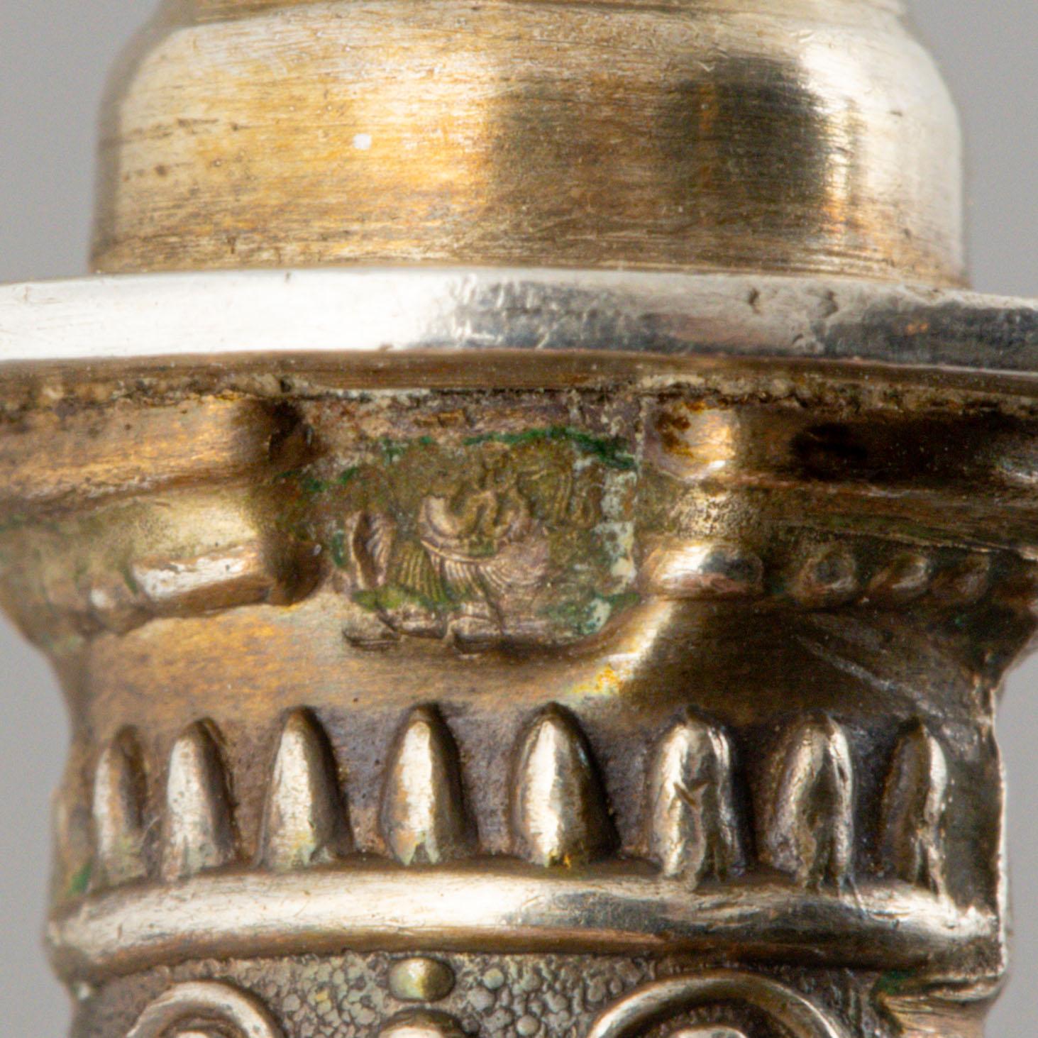 A set of six French silver pork chop holders, circa 1900.
