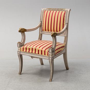 An Italian 19t century painted and scupted armchair.