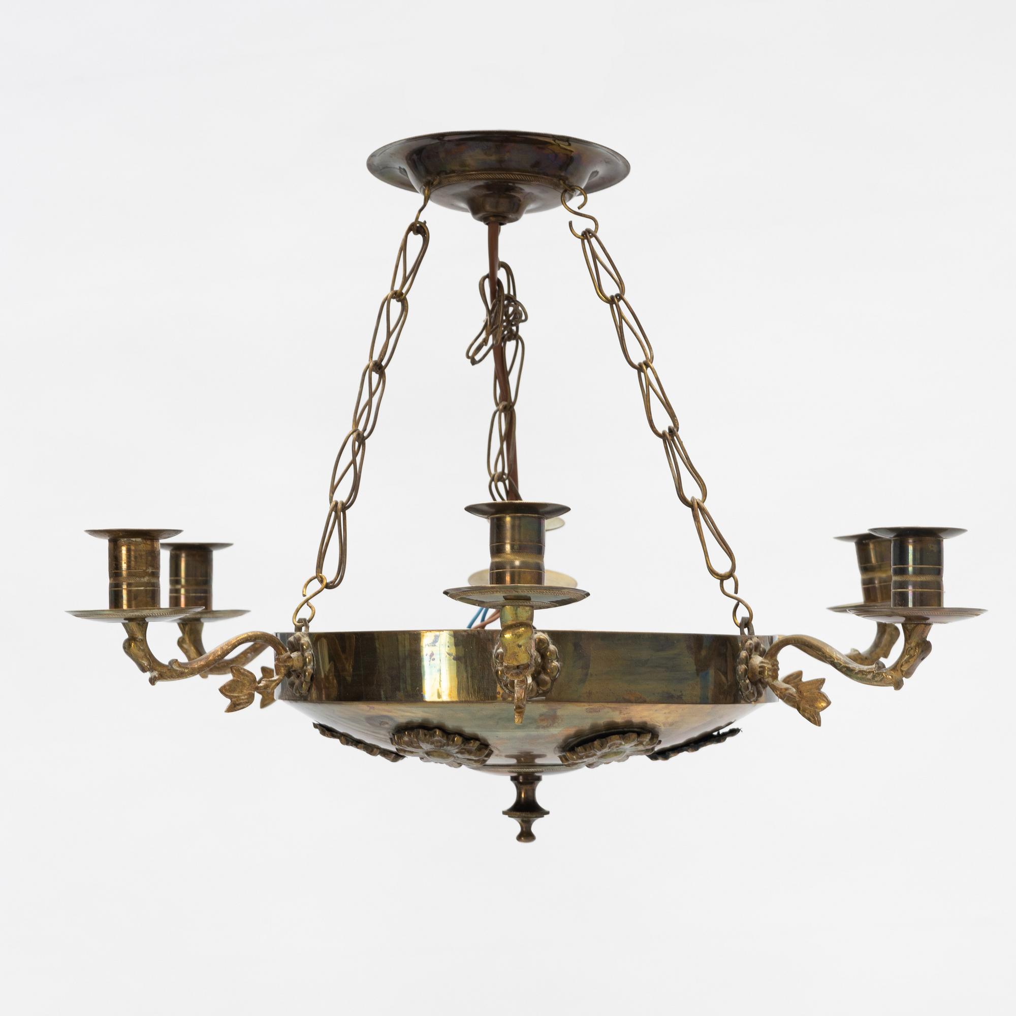 An empire style brass chandelier, around 1900.