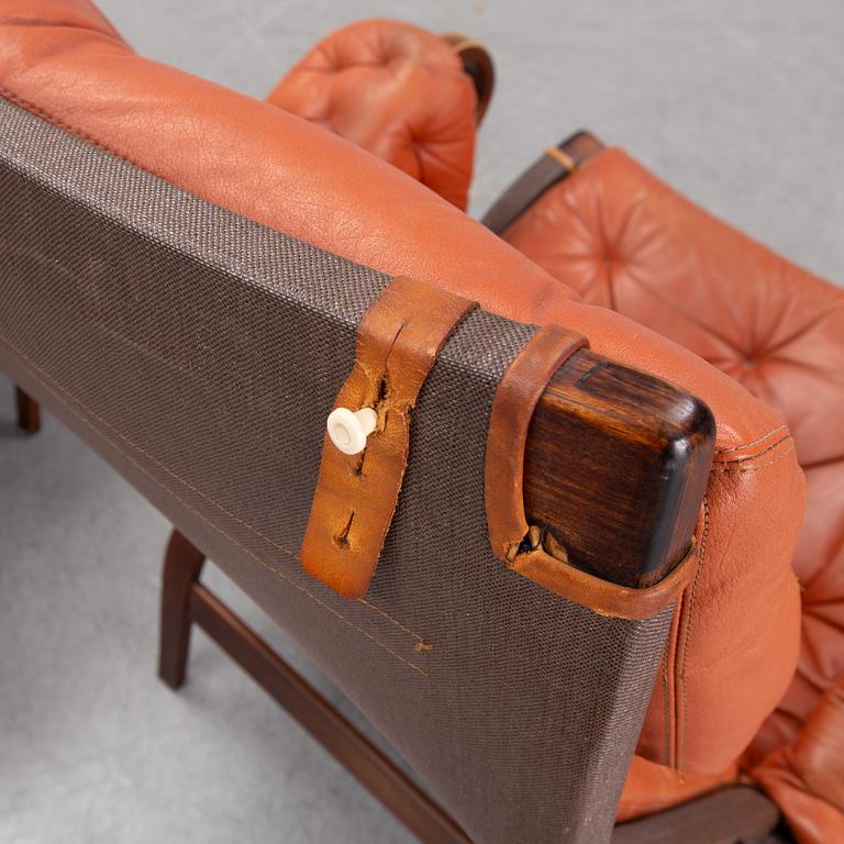 An end of the 20th Century pair of 'Pernilla' easy chairs with leather upholstery by Bruno Mathsson for DUX.