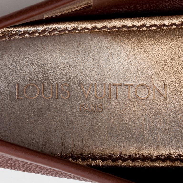 LOUIS VUITTON, a pair of brown leather loafers.