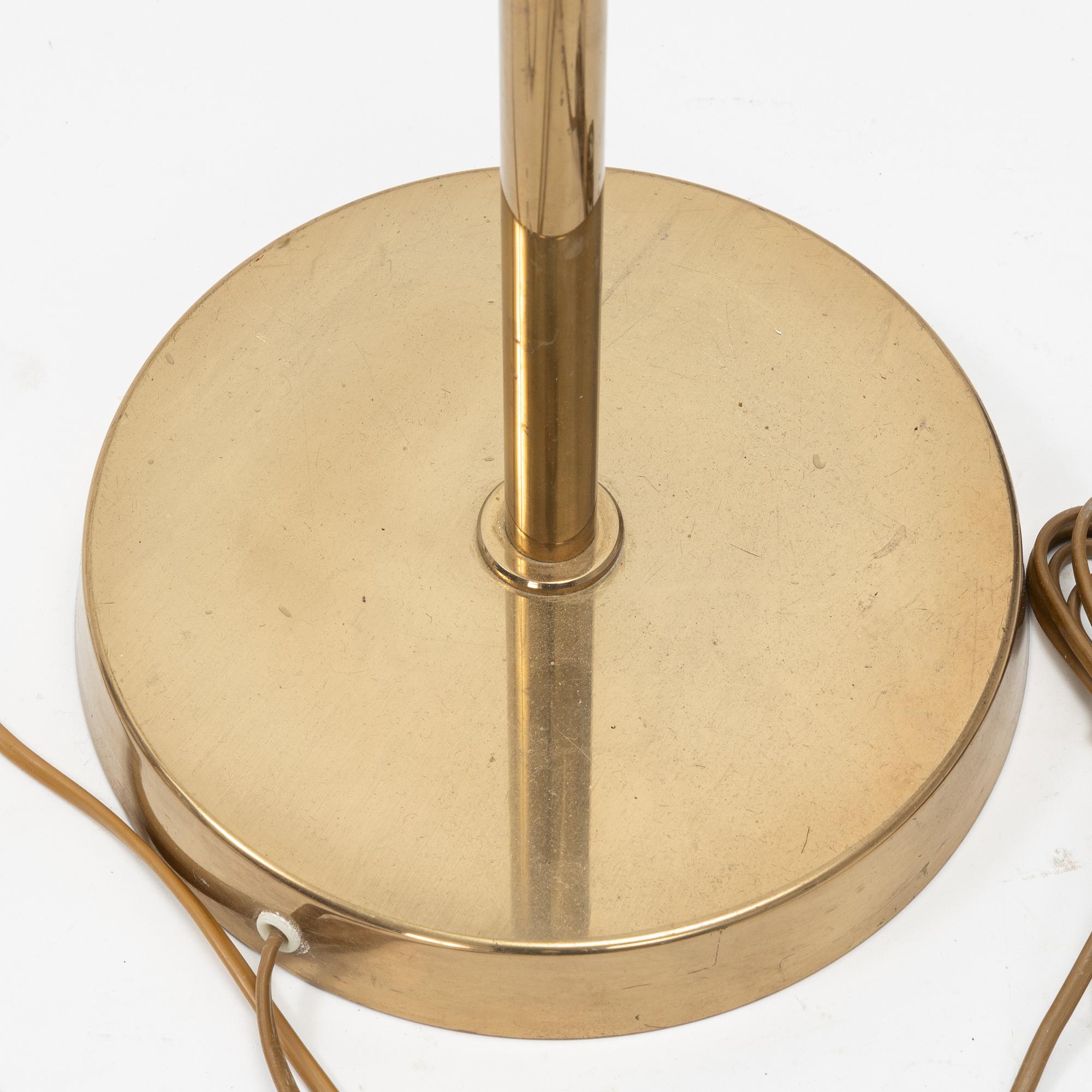 A pair of model 'G-18' brass floor lights, Bergboms, second half of the 20th Century.